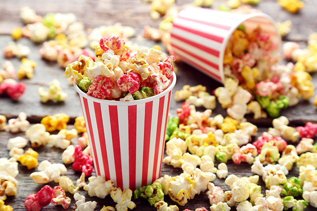 Sweet popcorn in striped cups